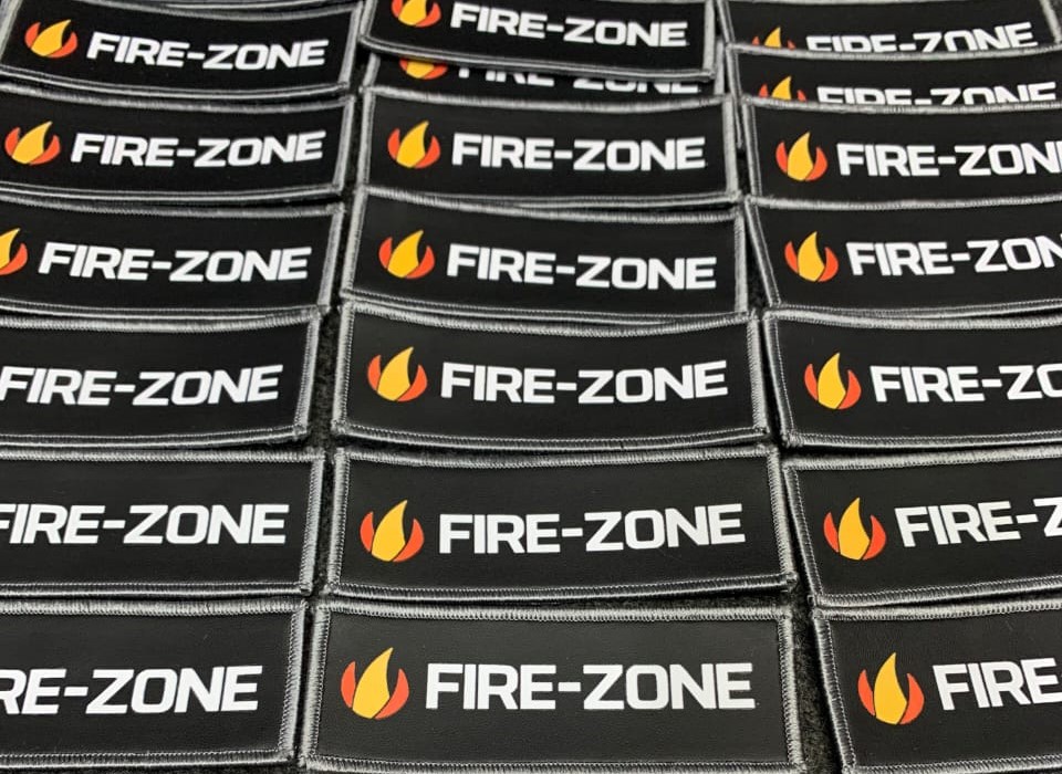 Rectangular patches with a black background displaying the text 'FIRE-ZONE